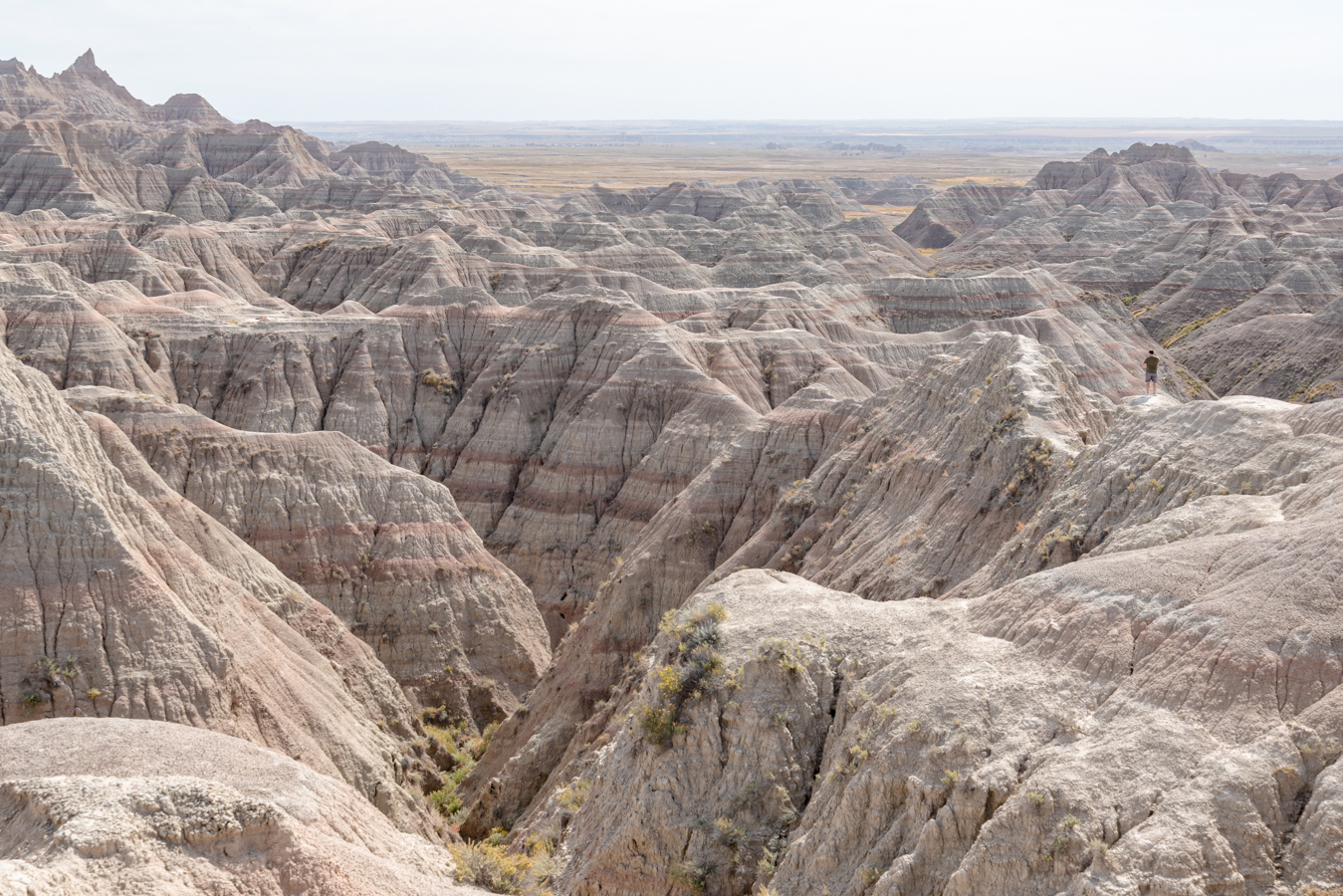 jeremy storm hiking through badlands national park south dakota itinerary